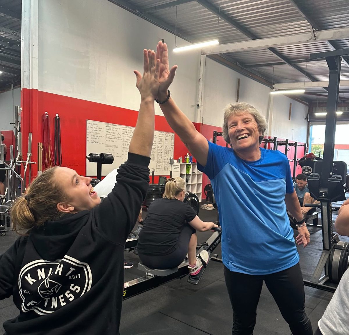 Bootcamp members sharing a high five