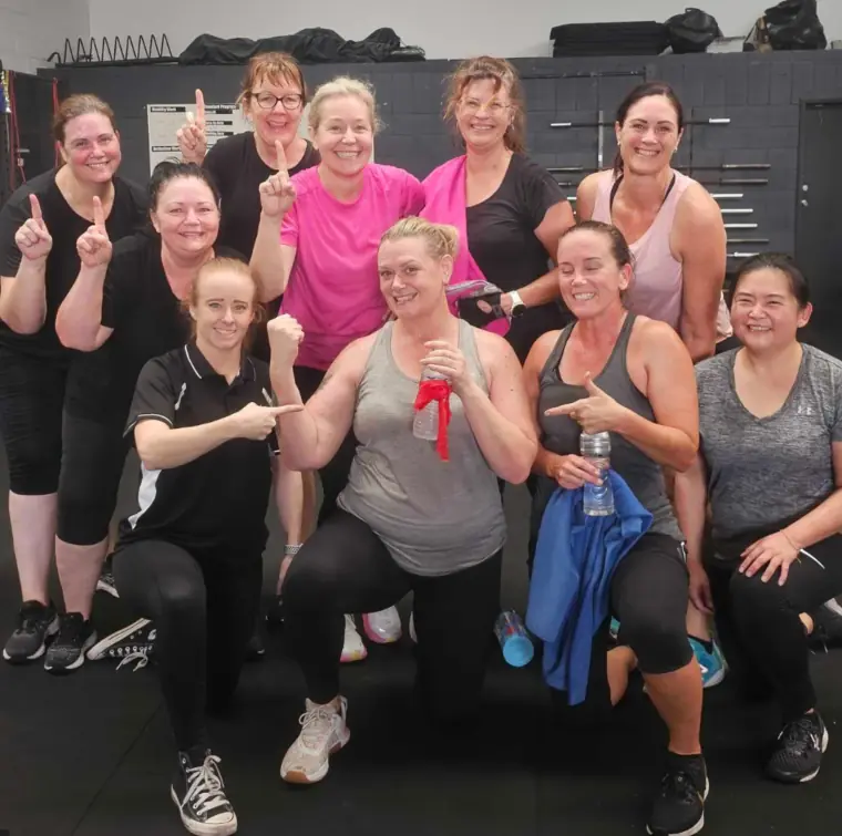 The Women's Club crew celebrating a member hitting her goal